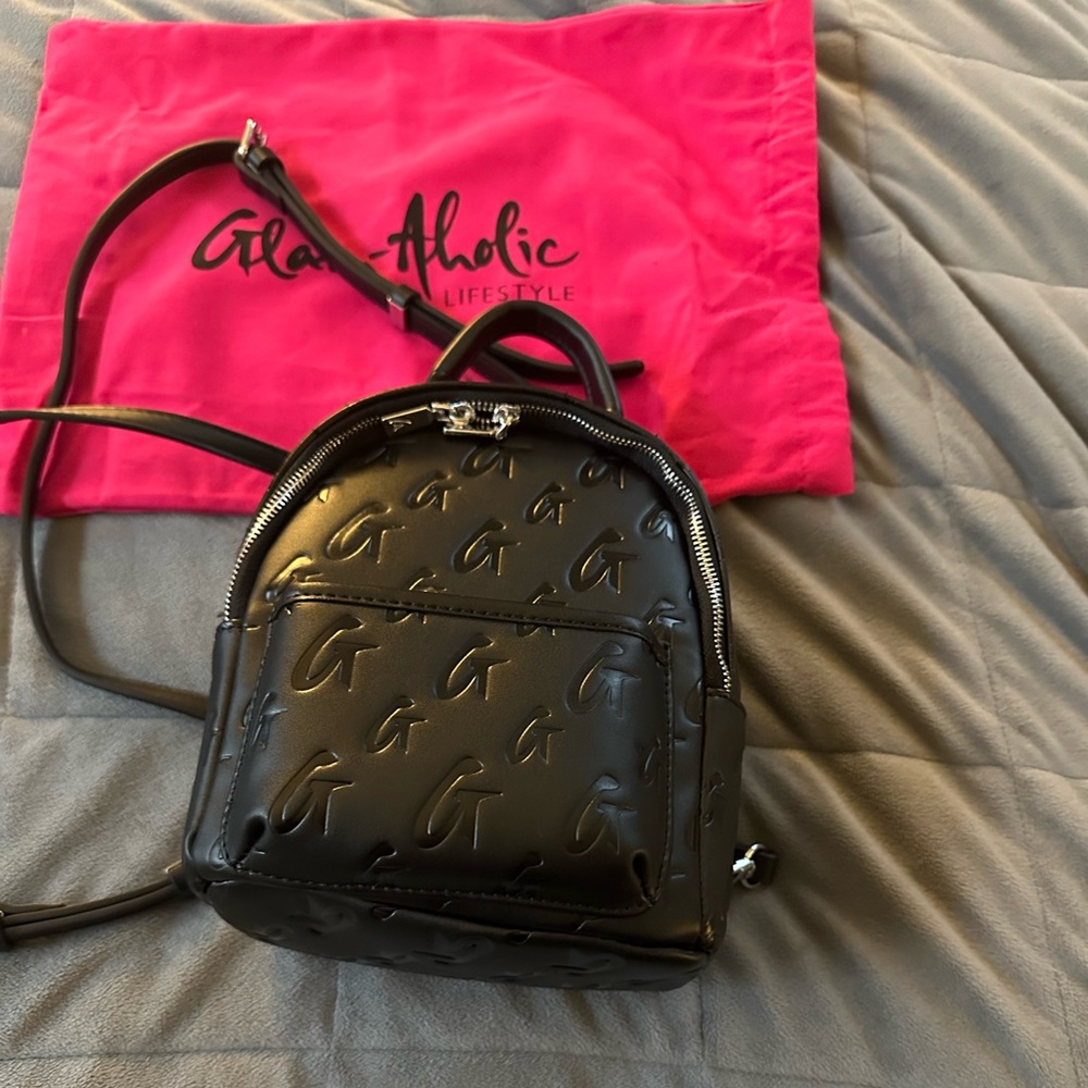 Brand new Mini Monogram Glam-Aholic backpack purse.